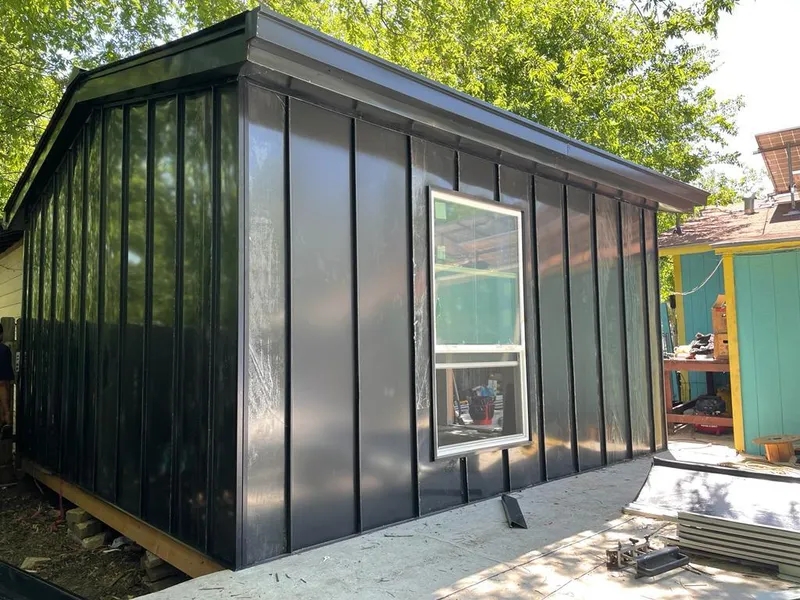 Black standing seam metal wall panels for Metal Roof Installation in Borger